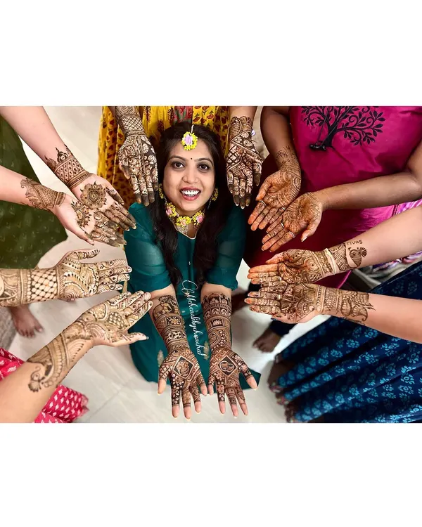 This is what it's all about: celebrating with your favorite people! I love creating a festive atmosphere where the bride and her entire tribe can get beautiful, coordinated mehendi. This picture with the bride and her bridesmaids perfectly captures the joy and togetherness of a mehendi party.