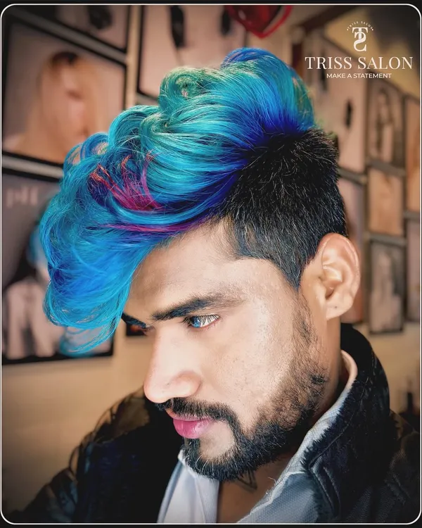 Unleashing the vibrant world of Crazy Colors by Keune. This look features a bold mix of blue and pink on a sharp undercut, perfect for anyone who dares to stand out and let their hair do the talking.