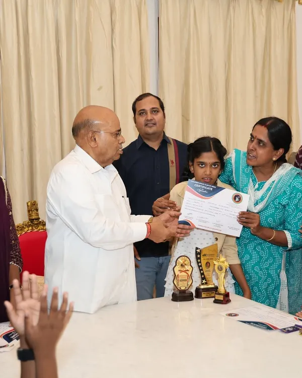 A truly proud moment as one of our young dancers receives a certificate of appreciation from the Honorable Governor of Karnataka, Shri Thawar Chand Gehlot. This recognition highlights the incredible dedication of our students.