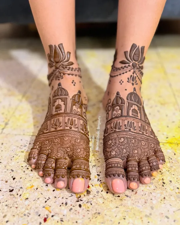 A stunningly intricate bridal foot mehendi. This design features detailed architectural domes and fine patterns covering the entire foot.