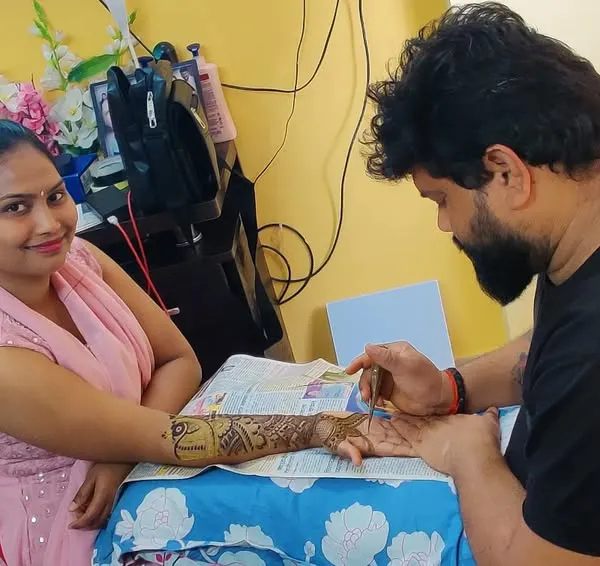 A candid moment applying mehndi for a client at her home. I always ensure my clients are comfortable during the application process.