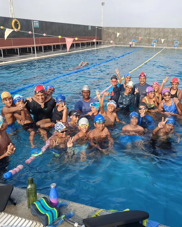 This picture says it all. It’s not just about teaching swimming skills; it’s about the pure joy on the faces of both the kids and the coaches. This is why I do what I do.