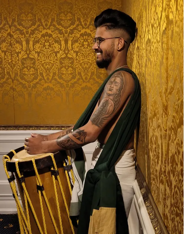 A modern artist with a traditional soul. Our member showcasing his tattoos and his love for the chenda.