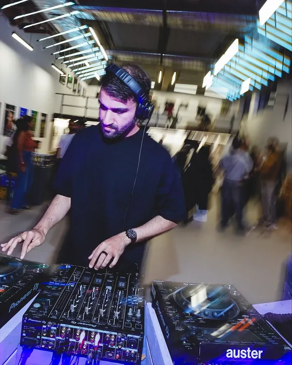A DJ spinning at the Boxout.fm 9-year anniversary exhibition. I curate and organize events that blend music and art, providing the perfect sonic backdrop for cultural happenings.
