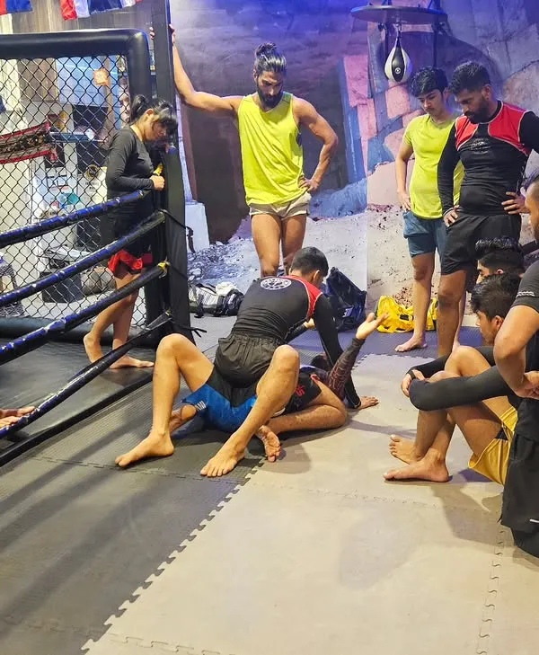 Muscle memory is key in grappling. Here, our fighters are drilling BJJ techniques, learning to execute moves instinctively until they become second nature.