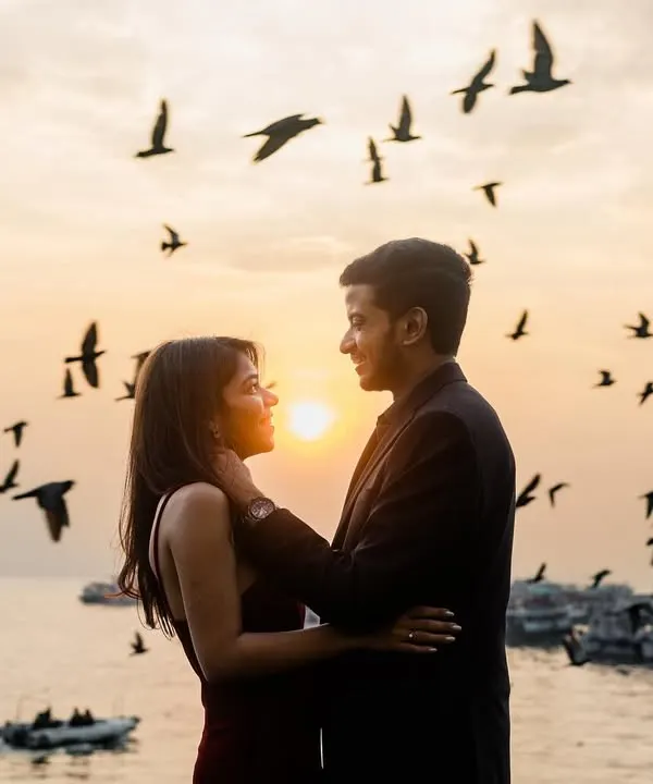 A silhouette of love against a golden sunset at the Gateway of India, with birds taking flight to frame the moment. This is the kind of epic, once-in-a-lifetime shot we live to create.