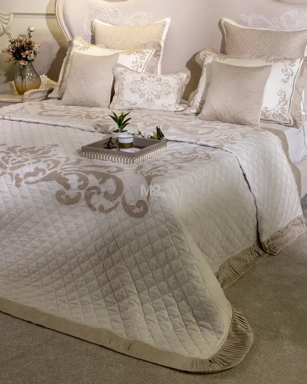 Our Magnolia-Themed Bed Cover Set, styled with a decorative tray. This view shows how the minimalistic luxury of the set, with its delicate embroidery and pleated fringes, creates a truly timeless piece.