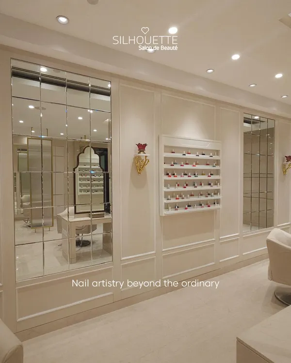 A glimpse into our curated space, where beauty and elegance converge. The wall of mirrors reflects our bright, clean aesthetic, while the neatly displayed polish collection hints at the world of color that awaits you.
