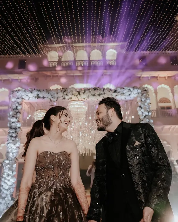A magical Sangeet night portrait under a ceiling of fairy lights. We use the stunning decor of your event to create romantic and glamorous shots for couples like Shriya and Sanchit.