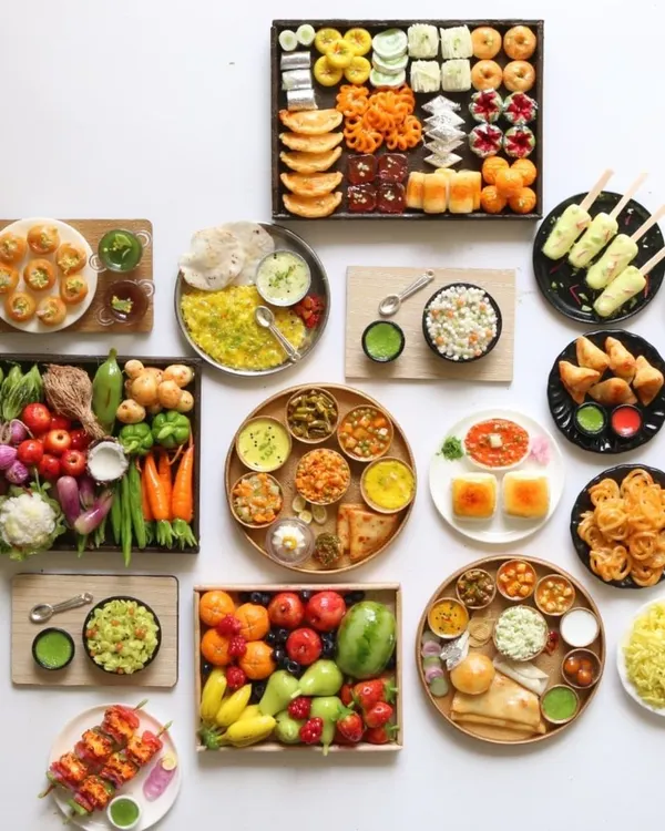 A beautiful display of my recent food miniature orders, showcasing the wide variety of dishes I can create.