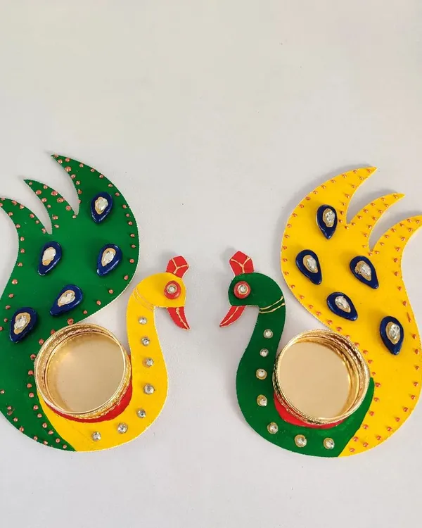 These beautiful peacock T-light holders were made right here in the studio. They are a perfect DIY project for Diwali, adding a personal, handmade touch to your festive decorations.