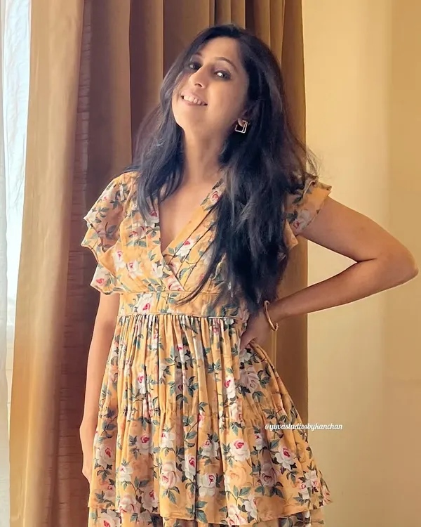 This yellow floral tiered dress is pure sunshine. The poly-cotton fabric is light and airy, and the ruffled layers add a touch of playful grace.