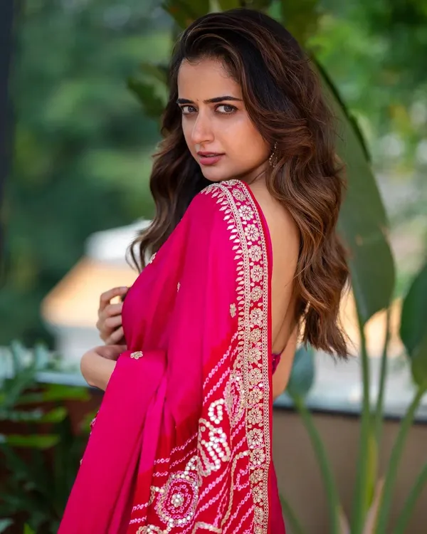 A portrait of actress Ashika Ranganath, captured outdoors with soft natural light. The goal was to create an expressive shot that feels both glamorous and genuine, perfect for a versatile acting portfolio.
