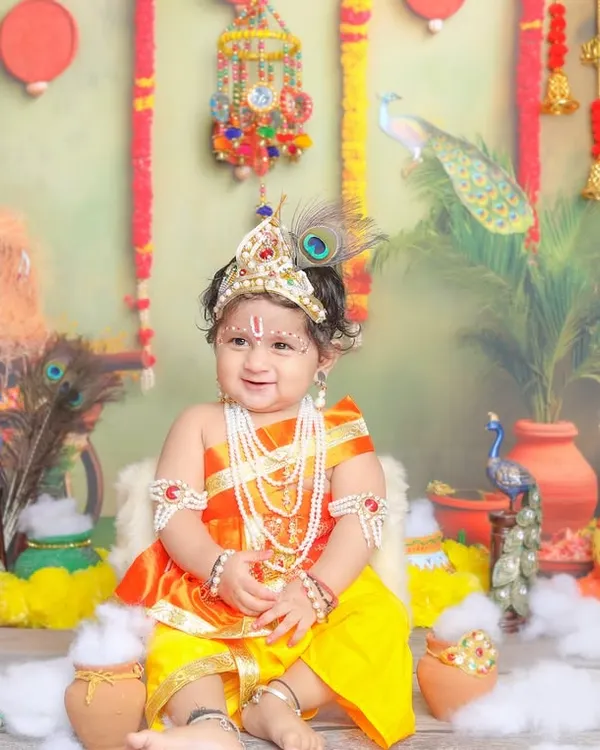 Your little Krishna, sitting on his throne. I design my sets with rich, traditional details to make these portraits feel authentic and special.