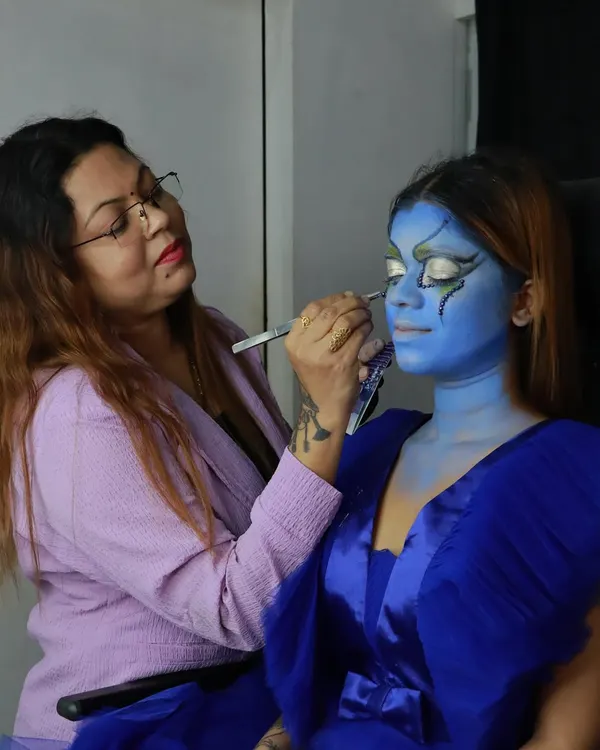 Here I am working on a complex fantasy look. Students get to watch and learn up close as I demonstrate advanced airbrushing and detailing techniques.