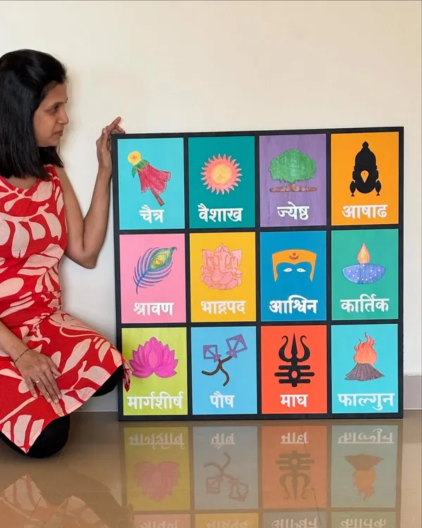This is one of my favorite creations, a large, hand-painted Marathi month calendar. Each square represents a month with its unique cultural symbol, making it a colorful and meaningful piece of home decor.
