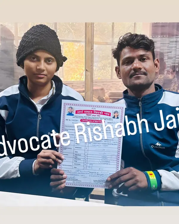 A happy couple proudly displays their official marriage certificate. My team ensures the court marriage procedure in Delhi is handled efficiently so you can get your certificate without delay.