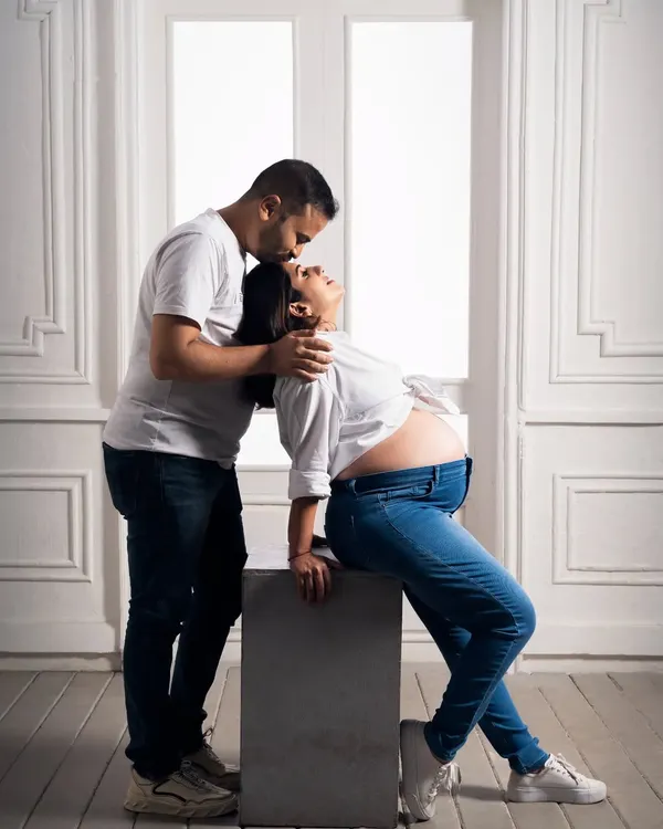 A quiet moment of connection between partners during a maternity shoot. We love capturing these gentle interactions that show the love and support surrounding the mom-to-be.