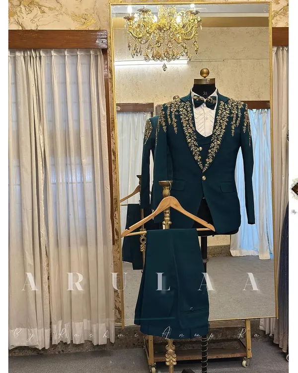 A full look at a custom-designed three-piece wedding suit in a striking teal. The ensemble includes the blazer, waistcoat, and trousers, all tailored from the same premium fabric for a cohesive and modern look.