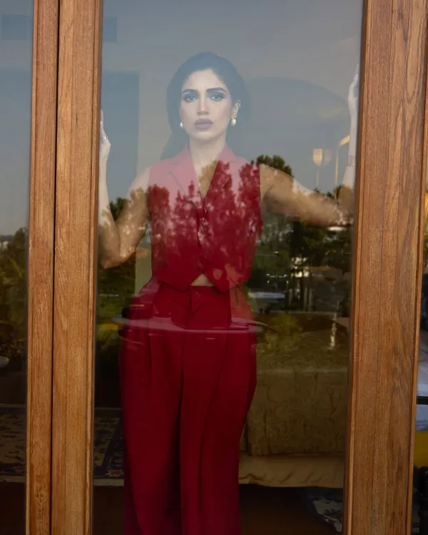 Painting the town red with Bhumi Pednekar in this Rohit Gandhi and Rahul Khanna pantsuit. This look is the definition of power dressing, with its sharp tailoring and bold color making a strong statement.