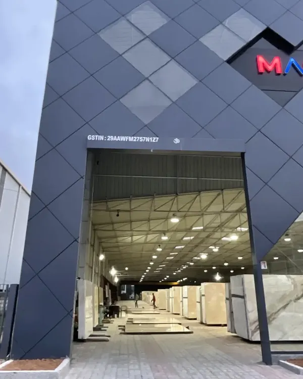 The completed facade for the Master Granitto marble store in Jigani. We worked with angular geometry, ACP panels, and glass to create a dynamic and modern form that reflects the nature of the business.