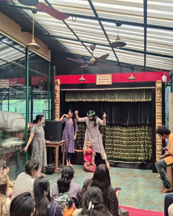 An intimate puppet show in progress at our centre. Here, you can see our artists engaging with the audience, demonstrating how traditional Indian string puppets are brought to life to tell timeless stories.