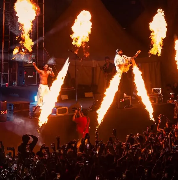 The raw power of a live hip-hop show. Hanumankind commands the stage with fire effects during a packed performance, delivering the high-octane energy I promise.
