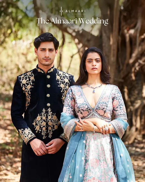 This is the ultimate goal for couple styling. His dark, ornate sherwani and her lighter, floral lehenga are perfectly balanced in color and detail, creating a cohesive and high-fashion statement.