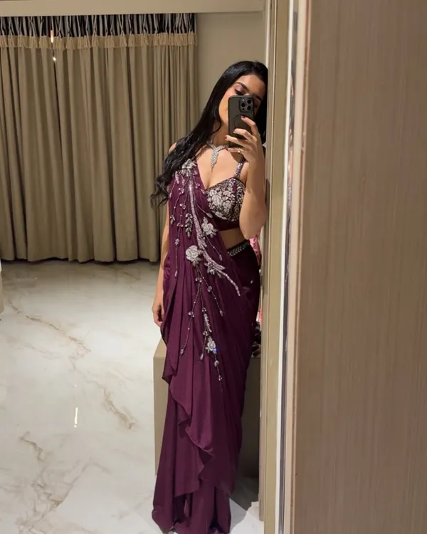 A mirror selfie showing off a gorgeous maroon draped saree. Sometimes the best shots are the ones you take yourself before heading out.