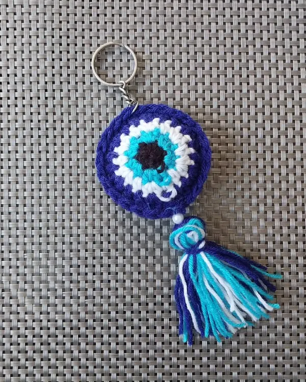 My classic crochet evil eye keychain, featuring a handmade tassel. This is one of my most requested items, perfect for adding a touch of protection and style.