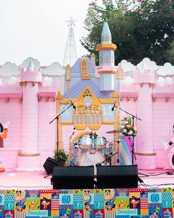 The main stage for a Disneyland-themed Christmas brunch. We built a custom Disney castle backdrop, complete with character cutouts of Goofy and Minnie Mouse, creating a magical setting for live entertainment.