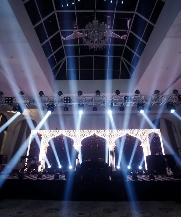The stage is set. I love capturing the grandeur of the decor before the party begins, highlighting the dramatic lighting and intricate design that creates the event's atmosphere.