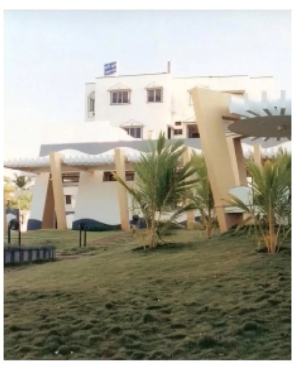 An archival photo of our CC Office project in Tuticorin from 2002. The design deliberately tucked the building to one side of the plot to create a large, manicured landscape, integrating the architecture and its natural surroundings.