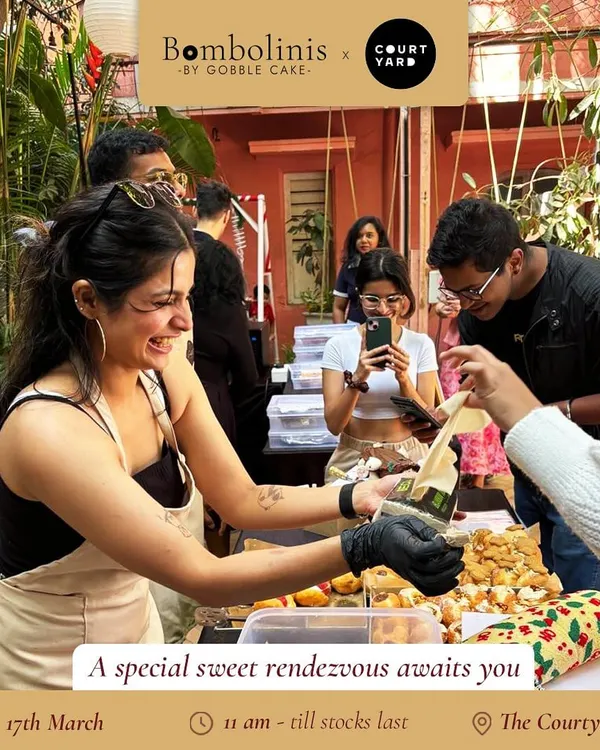 All smiles while serving up sweet treats at a special bake sale at The Courtyard.