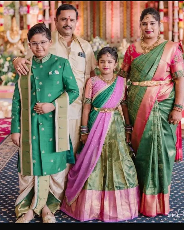 I had the pleasure of designing this complete family look for a special ceremony. We chose a beautiful green and pink theme, creating a custom langa voni for the daughter and a smart sherwani with a dhoti for the son, perfectly complementing the parents' elegant silk attire.