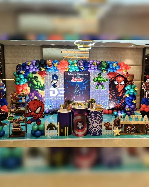 An epic superhero assembly for Satyam's 7th birthday! This massive setup brings together Spiderman, Hulk, Captain America, Superman, and Iron Man with a shimmering backdrop and an action-packed balloon garland.