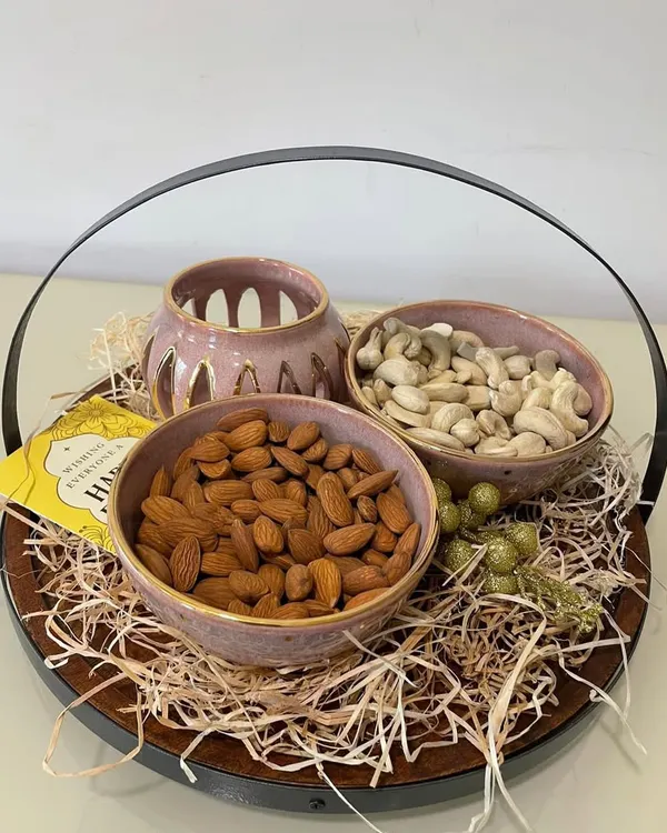 For Diwali, I create these specially curated gift hampers. This one features my 24-carat gold-coated blushing pink bowls and a matching tealight holder, perfect for festive gifting.