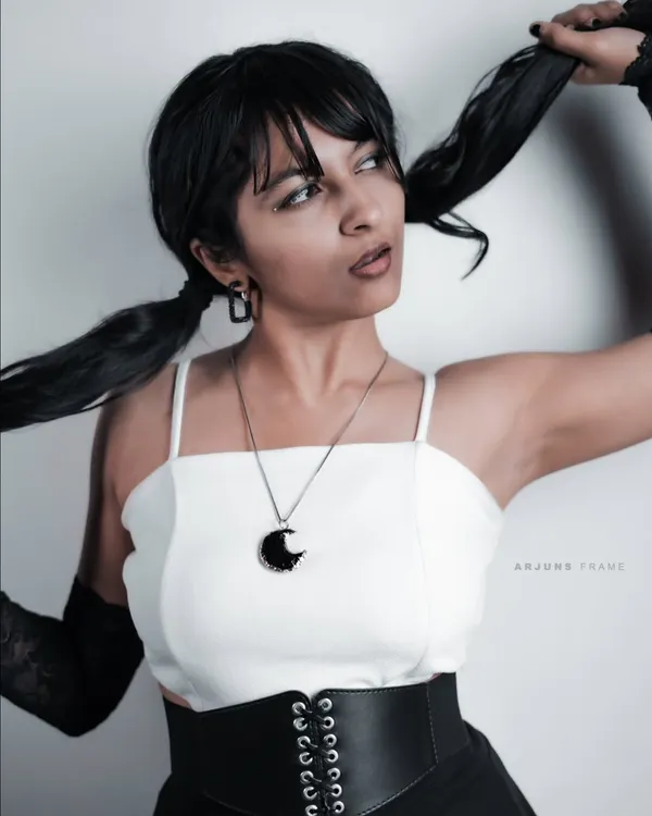 This is the energy I bring to my alternative fashion work. I styled this punk-inspired look myself, combining a corset belt, lace gloves, and a playful attitude for a high-contrast studio photoshoot.