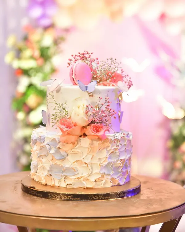 I also arrange for custom cakes to match your theme. This beautiful two-tiered cake with flowers and macarons was perfect for a butterfly party.