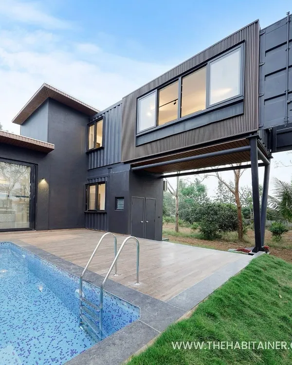 This is what I love to build: a stunning, custom-designed container farmhouse that combines bold architecture with the comforts of a luxury retreat. Notice the cantilevered second floor, a design feature that creates a dramatic look while being structurally sound, all made possible with repurposed shipping containers.