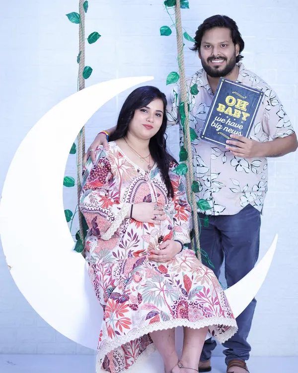 "Oh baby, we have big news!" This couple's announcement photo on our moon swing set is a fun and popular way to share your excitement with family and friends.