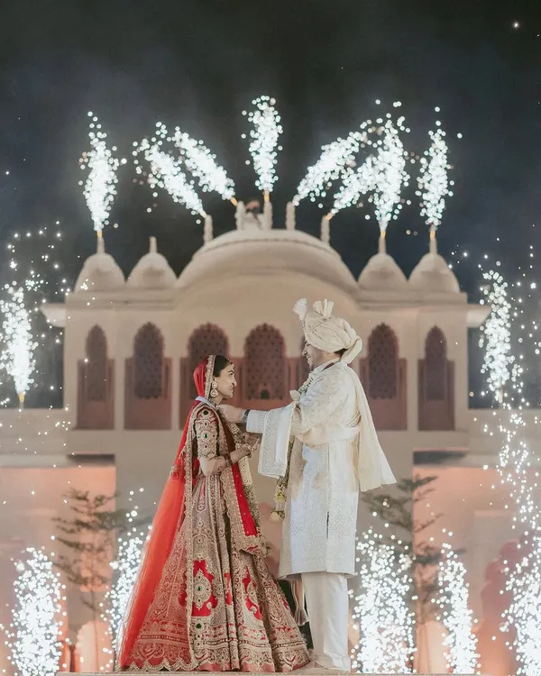 A fairytale moment brought to life against the backdrop of a royal palace, illuminated by a spectacular display of fireworks. We orchestrate these shots to create a truly iconic memory of your union.