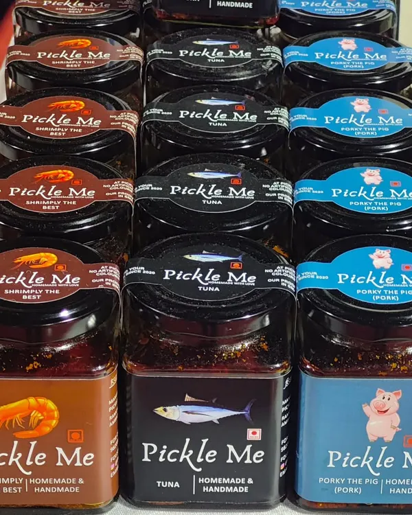 A lineup of our non-vegetarian bestsellers. Featuring our 'Shrimply the Best' Prawn Pickle, classic Tuna Pickle, and the rich 'Porky the Pig' Pork Pickle, all handmade with authentic spices.