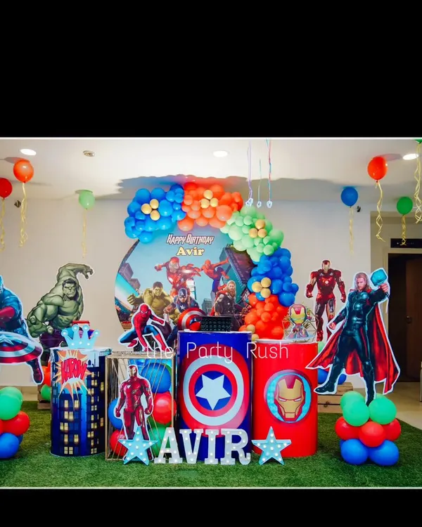 Avengers assembled for Avir's third birthday with this action-packed superhero setup. The decor features life-sized cutouts of heroes like Captain America, Hulk, and Thor, along with themed plinths and a vibrant balloon arrangement.