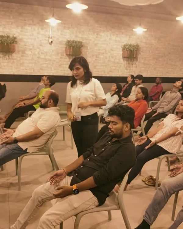 Finding moments of calm during a busy workday is essential for mental health and productivity. Here, I am guiding a corporate group through a chair yoga and meditation session, a simple practice designed to release tension and restore focus right at the office.