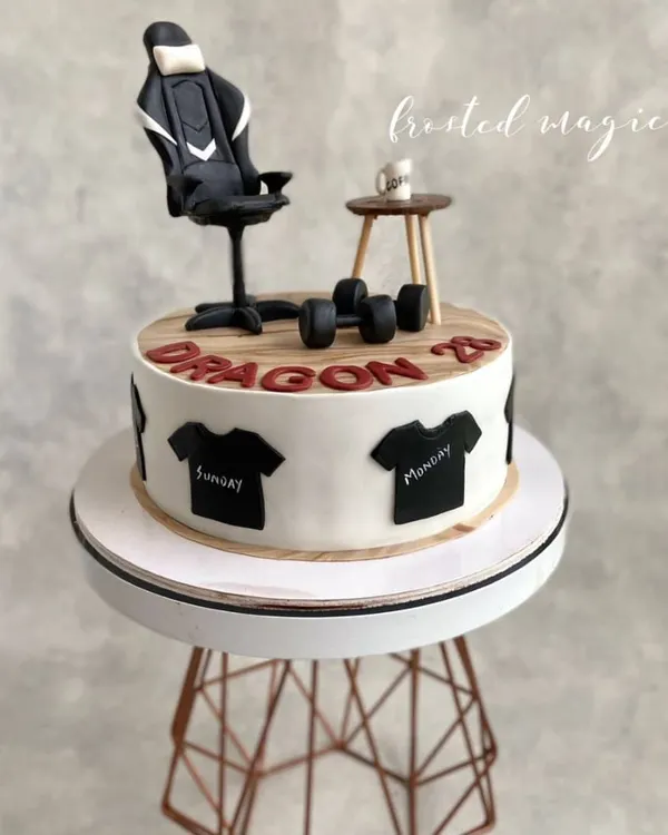 This cake was designed for someone whose favorite things include their gaming chair, coffee, and working out. I recreated these items in miniature form as edible toppers to make a cake that's all about them.