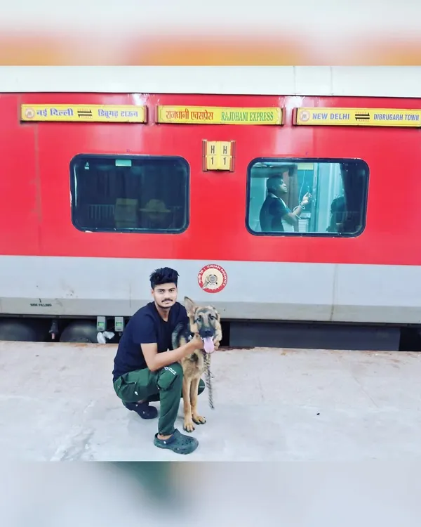 Posing with a German Shepherd on the platform at New Delhi station before starting our journey from Dibrugarh.