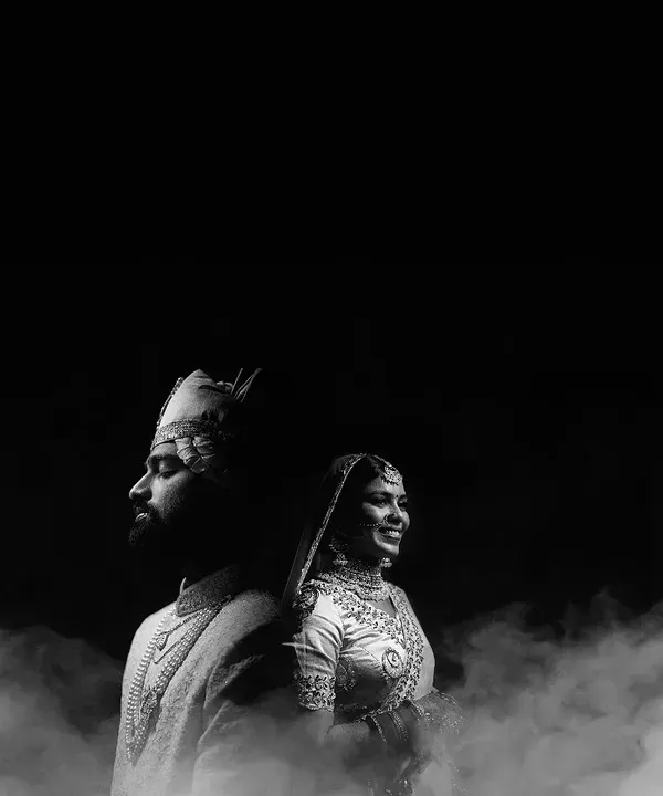 A dramatic black and white portrait of the couple, created with artistic lighting and a smoke effect. This is an example of a signature shot we can create to give you a timeless, powerful image.