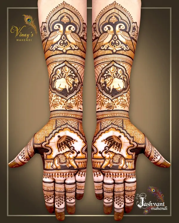 A stunning symmetrical design featuring royal elephants with umbrellas on the palms and forearms. The intricate details and traditional motifs give it a truly regal feel.