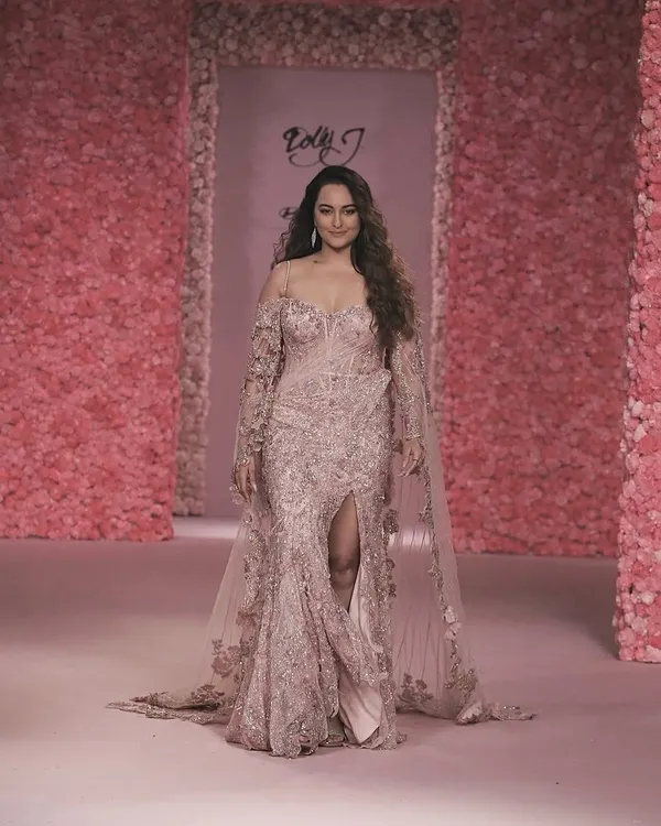 Sonakshi Sinha walks the runway for Dolly J's 'La Vie En Rose' couture show. The backdrop is a testament to our large-scale floral work, with every surface covered in pink blooms to create a completely immersive, romantic atmosphere.